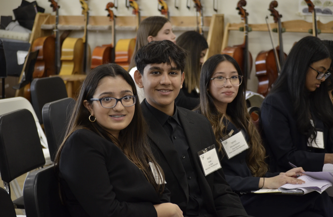 MUNners Sanjna Nischal, Jay Shah and Bea Navarro smile with confidence before presenting. (Photo source: Rebecca John)